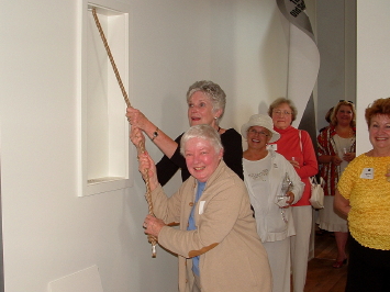 Nancy Budd (foreground) and Dottie Lyon pull together in first ringing of Old School House bell.